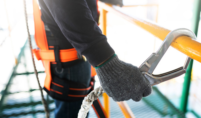 construction-worker-wearing-safety-harness-safety-line-working-construction.jpg 